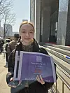 A fan poses with the BTS special edition of the Korea JoongAng Daily in central Seoul on March 21. [KIM MIN-YOUNG]