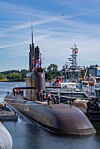 A KSS-III submarine is moored beside naval vessels at Canadian Forces Base Esquimalt during a joint exercise arrival.