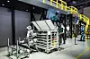 Atlas, a humanoid robot unveiled by Hyundai Motor Group and its robotics affiliate Boston Dynamics at CES 2026, demonstrates moving automotive parts at the group’s exhibition booth in this photo provided by Hyundai Motor on Jan. 18. [HYUNDAI MOTOR]