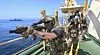 Members of a boarding team composed of Navy Special Warfare personnel conduct a search and antipiracy operation aboard a vessel simulating a hijacked merchant ship during the Cheonghae Unit 46th rotation’s joint anti-piracy drill in waters off Geoje, South Gyeongsang, on Aug. 1, 2025. [ROK NAVY/YONHAP]