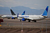 United Airlines jetliners gather on the tarmac to wait for clearance to take off as high winds strafe Denver International Airport in Denver on March 12. [AP/YONHAP]