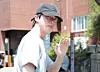 BTS member Jin waves to the camera as he walks into a polling station in Hannam-dong in Yongsan District, central Seoul, on June 3. [NEWS1]