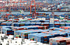 Containers are stacked at the yards of Busan Port on March 31. [NEWS1]