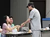 BTS member Jin receives ballots for the local elections at a polling station in Hannam-dong in Yongsan District, central Seoul, on June 3. [NEWS1]