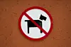 No dogs sign in orange wall background [GETTY IMAGES BANK]