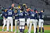 NC Dinos players celebrate beating the SSG Landers in Incheon on May 7. [YONHAP]