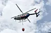 A firefighting helicopter heads toward the scene of the explosion that occurred at Hanwha Aerospace’s Daejeon facility on June 1. [NEWS1]