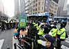 Members of the civic group Solidarity Against Disability Discrimination are sealed off by police during the group's protest on Sejong-daero, a street in Jongno District, central Seoul, on March 27. [YONHAP]