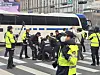 Police restrain a member of the Solidarity Against Disability Discrimination who came to protest at a bus station near Gwanghwamun in Jongno District, central Seoul, on March 27. [YONHAP]