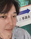 Actor Yoon Jong-hun takes a photo in front of a polling station sign in a photo uploaded to his Instagram on June 3. [SCREEN CAPTURE]