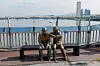 A bronze sculpture in the shape of two people consoling each other is seen on Mapo Bridge in western Seoul on Sept. 25, 2025. The sculpture intends to prevent suicide attempts on the bridge. [NEWS1]