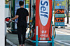 A man loads up his vehicle with fuel at a gas station in Seoul on April 15. [YONHAP]