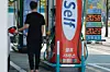 A man loads up his vehicle with fuel at a gas station in Seoul on April 15. [YONHAP]