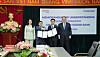 Woori Bank CEO Jung Jin-wan, far right, poses for a photo with Viettel Global General Director Nguyen Thi Hoa, far left, after signing the memorandum of understanding between the two countries at Viettel Global headquarters in Hanoi, Vietnam, on April 22. [WOORI BANK]