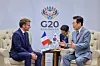 President Lee Jae Myung, right, and French President Emmanuel Macron hold talks on the sidelines of the Group of 20 summit in Johannesburg, South Africa, on Nov. 22, 2025. [YONHAP]