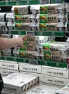 A consumer grabs a package of eggs at a large store in Seoul on June 3. [NEWS1]