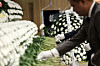 People lay flowers at a funeral home in Wando County, South Jeolla, on April 13 to pay their condolences to two firefighters killed in a cold storage warehouse fire. [YONHAP]