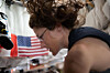 NASA astronaut and Artemis II mission specialist Christina Koch preps for lunar flyby activities after completing aerobic exercise on the flywheel device on April 4. [NASA]