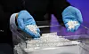 An official shows seized silver ahead of a briefing on intensified crackdowns following an increase in silver smuggling at Incheon Airport Regional Customs in Incheon, on April 8. [NEWS1]