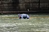 A police official looks for a suitcase that was thrown into a stream near Chilseong-dong, Daegu, after a report was filed about a suspicious suitcase floating in the stream on March 31. A body was found inside the suitcase after police retrieved it. [NEWS1]