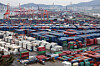 Containers are stacked at a cargo terminal in Busan Port on March 6. [YONHAP]