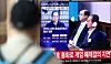 Citizens watch former President Han Duck-soo's trial, aired through television, inside Seoul Station in central Seoul on May 7, 2026. [NEWS1]