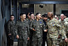 South Korea's Joint Chiefs of Staff (JCS) Chairman Gen. Jin Yong-sung, front second from left, talks with U.S. Gen. Xavier Brunson, front second from right, chief of the South Korea-U.S. Combined Forces Command, as he visits CP Tango, or Command Post Theater Air Naval Ground Operations, in Seongnam, Gyeonggi, on March 11. [JOINT CHIEFS OF STAFF]