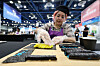 A person makes gimbap (seaweed rice rolls) at the 2026 Korea Seafood Show at Coex in Gangnam District, southern Seoul, on May 19. The event brings together 88 companies from eight countries, including China, Japan, Vietnam and the Philippines, operating 288 booths through Thursday. [YONHAP]