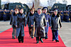 North Korean leader Kim Jong-un, center, and his daughter, second from left, wear long black leather overcoats as they arrive at a ceremony in Wonsan, Kangwon Province, to mark the 80th anniversary of the establishment of the regime's air force on Nov. 28, 2025, in this photo released two days later by Pyongyang's state-controlled Korean Central News Agency. [YONHAP]