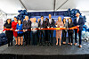 Attendees pose for a photo at a ceremony marking the completion of the acquisition at a biopharmaceutical production facility in Rockville, Maryland, on March 31. From fifth from left in the front row are Kang Kyung-wha, ambassador of Korea to the United States; John Rim, president and CEO of Samsung Biologics; Maryland Gov. Wes Moore; and Democratic Rep. April McClain Delaney. [SAMSUNG BIOLOGICS]