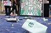 Starbucks tumblers and cups are seen broken and dented at a press conference condemning Starbucks Korea held in front of the E-Mart Gwangju branch on May 21. [YONHAP]