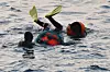 Female divers, also known as haenyeo, plunge into the waters off Pohang, North Gyeongsang, on March 11. [NEWS1]