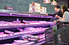 Customers look at meat products at a supermarket in Seoul on March 16. [YONHAP]