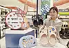 Collaborative products between the KBO League and Crocs Jibbitz are on display at a pop-up store at Lotte Department Store’s Busan branch on May 13. KBO-themed items, including caps and gloves, are available in accessory form.[LOTTE DEPARTMENT SOTRE]