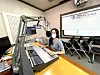 Maria Teresa Dyani poses for a photo in a studio at English-language radio station Busan e-FM during her one-month internship. [MARIA TERESA DYANI]
