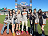 Girl group NMIXX poses for photos with Lee Jung-hoo of the San Francisco Giants, center, before its performance and ceremonial pitch for a MLB game between the Giants and the Philadelphia Phillies at Oracle Park in San Francisco on April 6 in this photo provided by JYP Entertainment. [YONHAP]