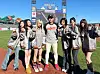 Girl group NMIXX poses for photos with Lee Jung-hoo of the San Francisco Giants, center, before its performance and ceremonial pitch for a MLB game between the Giants and the Philadelphia Phillies at Oracle Park in San Francisco on April 6 in this photo provided by JYP Entertainment. [YONHAP]