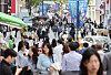 Pedestrians walk in the streets of Myeongdong, central Seoul, on April 29. [YONHAP]