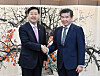 Korea's Finance Minister Koo Yun-cheol, left, and James Kim, chairman of the American Chamber of Commerce in Korea take a photo after their dialogue on elevating Korea’s standing as a global financial hub at the Seoul government complex in central Seoul on April 28. [AMCHAM KOREA]