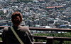A person views houses in Seoul from Mount Namsan [NEWS1]