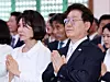 President Lee Jae Myung, right, and first lady Kim Hye-kyung put their hands together in prayer at a ceremonial celebration marking the 2,570th anniversary of Buddha's birth at a temple in Yangju, Gyeonggi, on May 24. [JOINT PRESS CORPS]