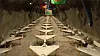 Footage released by the Iranian state-affiliated Fars news agency reveals rows of drones stored in underground tunnels and mounted on rocket launchers with walls adorned by Iranian flags. [SCREEN CAPTURE]