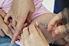 A child receives a flu vaccine at a hospital in Seongbuk District, central Seoul, on Oct. 2, 2025. [YONHAP]
