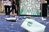 Smashed Starbucks tumblers and cups lie on the ground during a press conference denouncing Starbucks Korea in front of Emart's Gwangju branch in Gwangcheon-dong in Seo District, Gwangju, on May 21. [YONHAP]