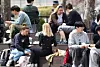 International students eat and talk among each other at a university campus in Seoul on April 9, 2025. [YONHAP]