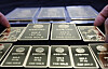 An employee arranges gold bars at a Samsung Gold Exchange store in Jongno District, central Seoul, on March 3. Gold prices, considered a major safe-haven asset, rose that same day, with the domestic price of gold trading at 249,900 won per gram ($4,800 per ounce) on the Korea Exchange's gold market in the morning, up 5.34 percent from the previous session. [YONHAP]