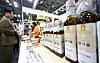 A visitor examines sesame oil at the Mega Show & Travel Show 2026 consumer goods fair, which opened at Kintex in Goyang, Gyeonggi, on May 14. [NEWS1]