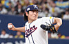 Korea's Gwak Been pitches during a tune-up game against the Hanshin Tigers at Kyocera Dome Osaka in Japan on March 2. [YONHAP]