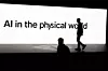 A screen reads 'AI in the physical world' as attendees gather during Rivian's first Autonomy and AI Day, showcasing developments in self-driving technology, in Palo Alto, California, Dec. 11, 2025. [REUTERS/YONHAP]