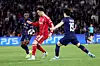 Ousmane Dembele, left, and Lee Kang-in, right of Paris Saint-Germain in action against Curtis Jones of Liverpool, center, during the UEFA Champions League quarter-finals, first leg match at Parc des Princes in Paris on April 8. [EPA/YONHAP]